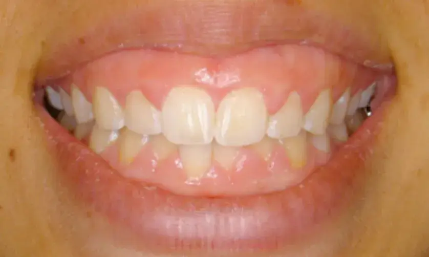 A woman with long hair smiling