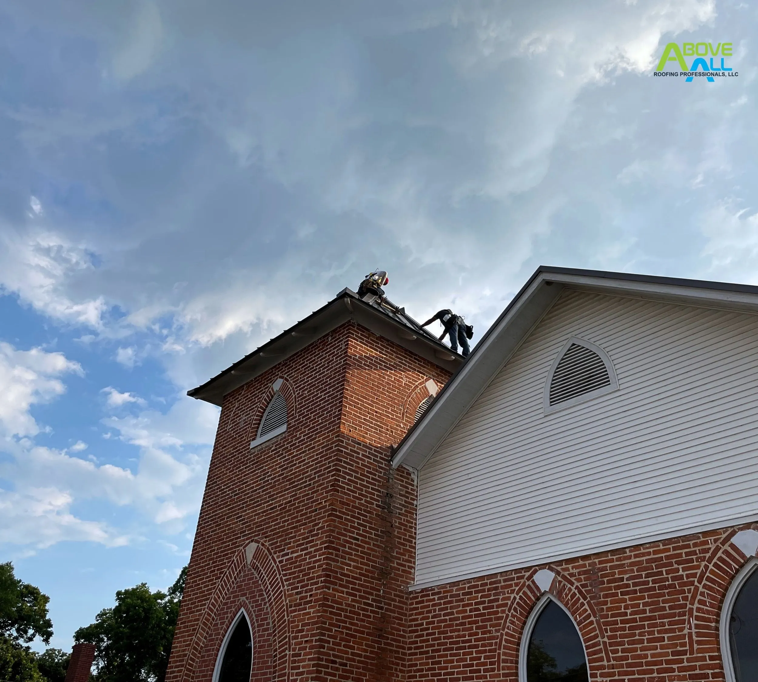 Roofers working on top of a building