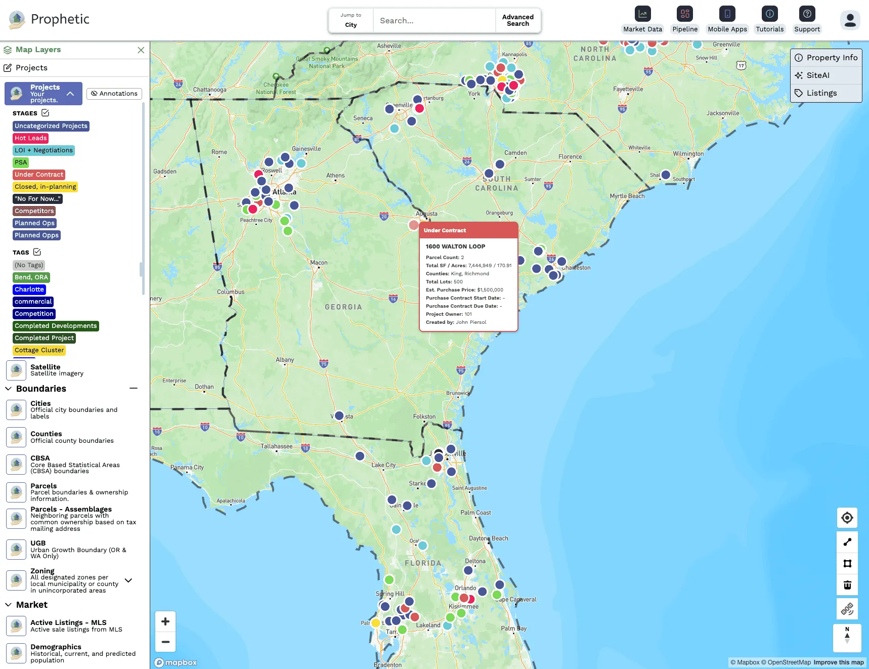 Interactive map showing various real estate projects with a highlighted tooltip for a project under contract.