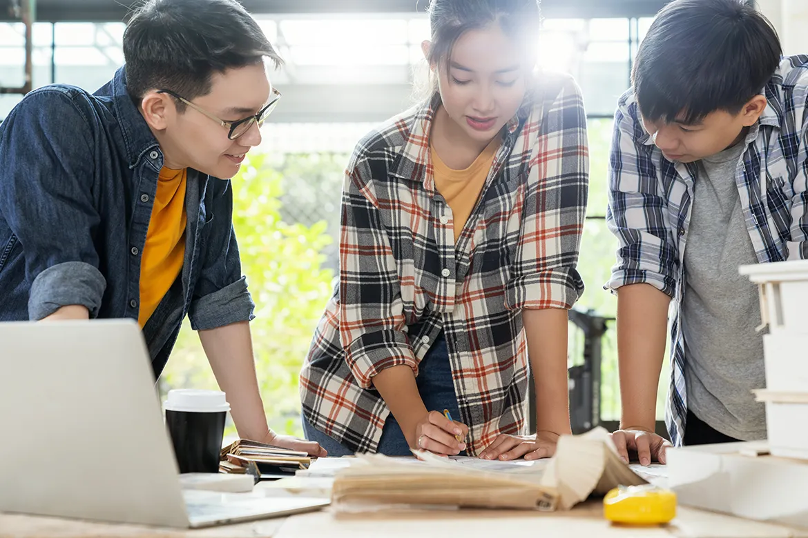 A person holding up a book that says book is brain food.