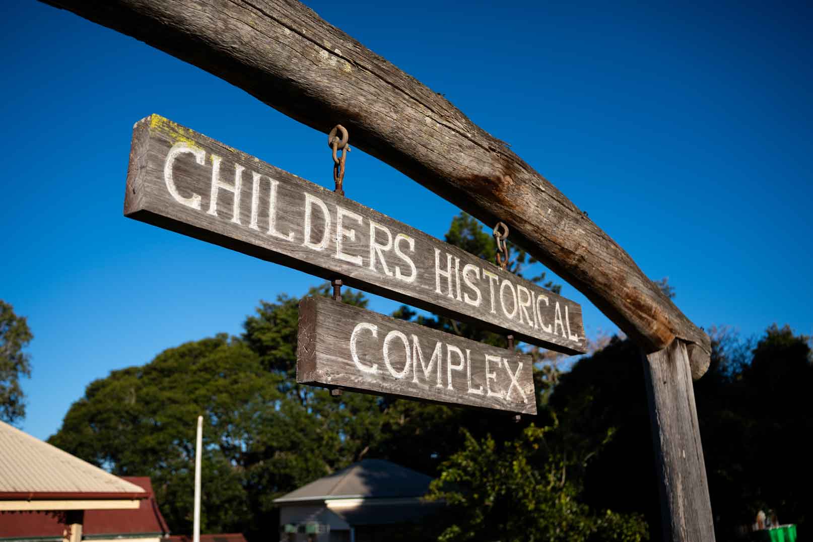Old Timber Entry Sign at the front of the Historical Complex