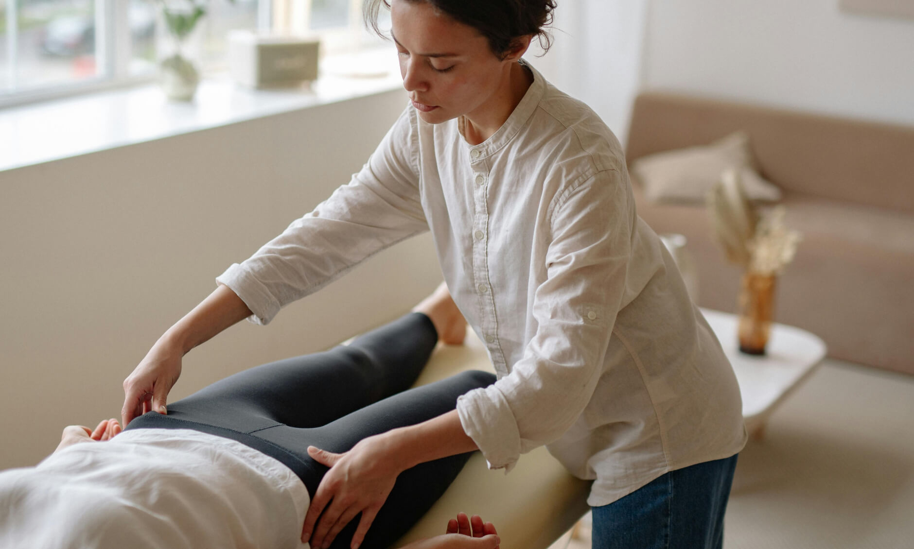 massage therapist performing a massage