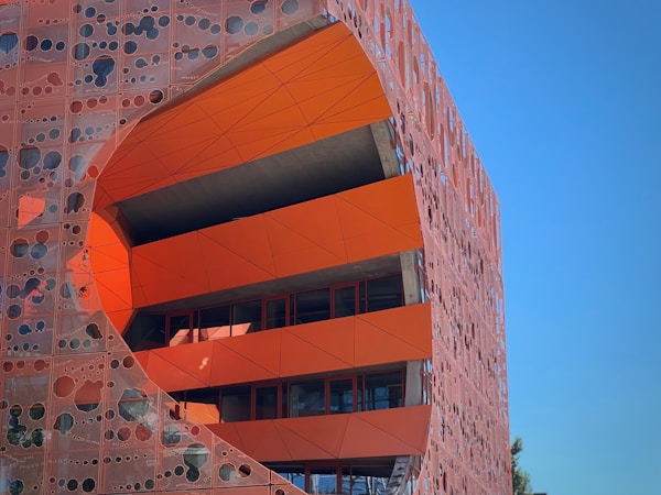 a building with a red and yellow exterior