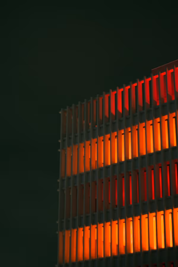 a building that has some orange lights on it