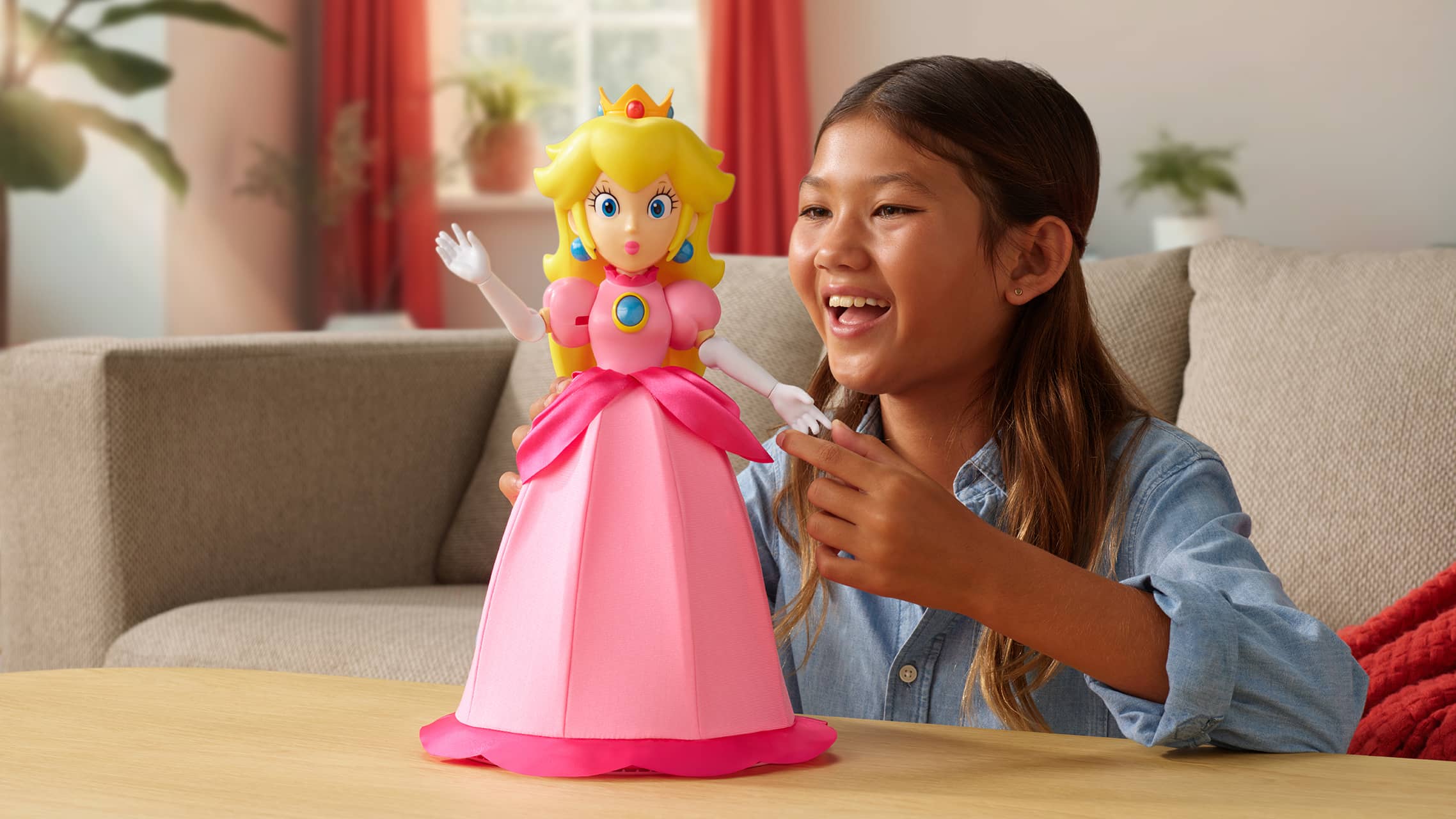 Child playing with Princess Peach figure from Super Mario toy line in living room