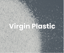 Close-up of white virgin plastic pellets on a dark background.