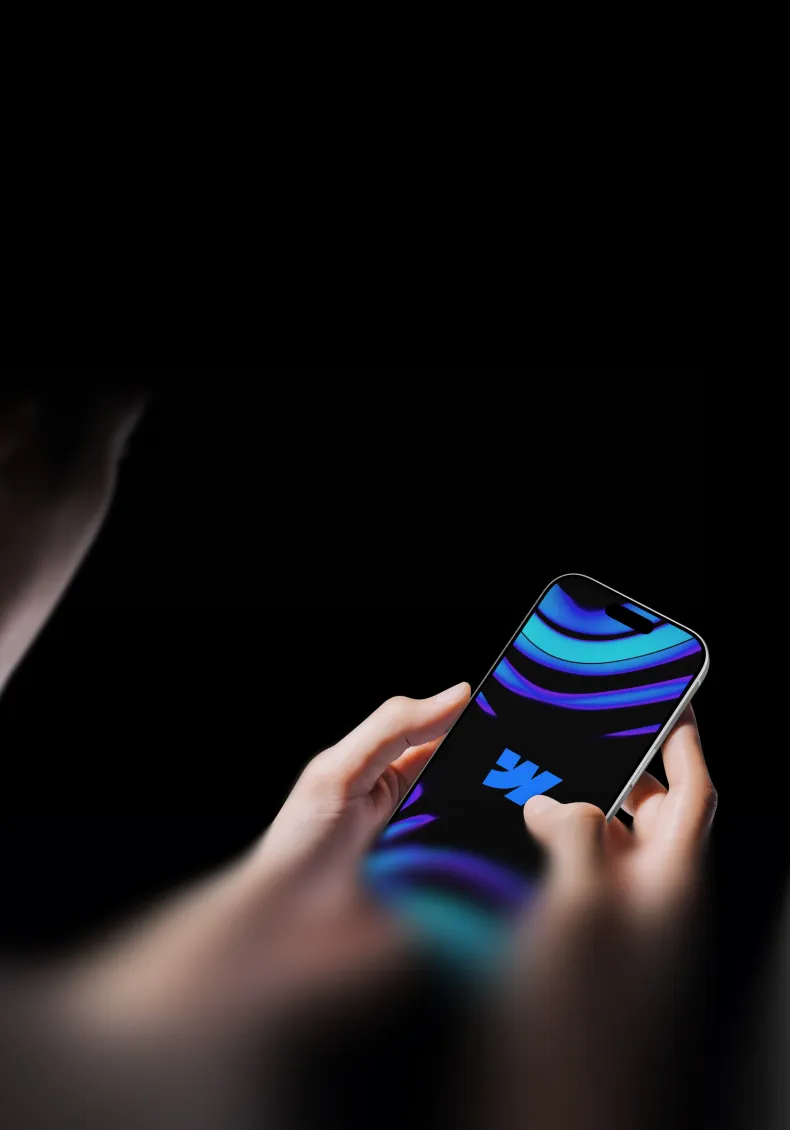Person holding a smartphone displaying a blue and purple abstract design on screen.