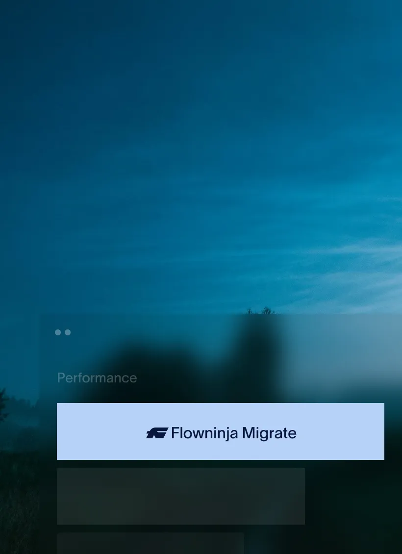 Mist-covered hills under a purple and pink sunset sky.