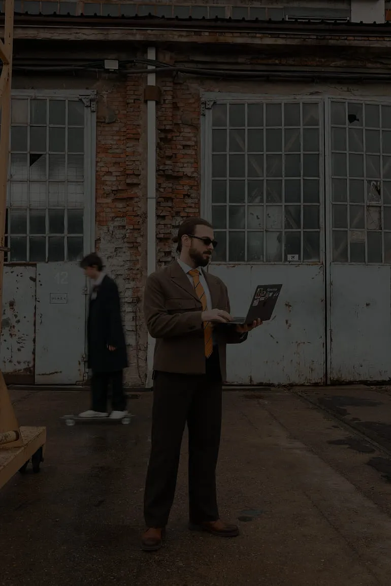 Mist-covered hills under a purple and pink sunset sky.