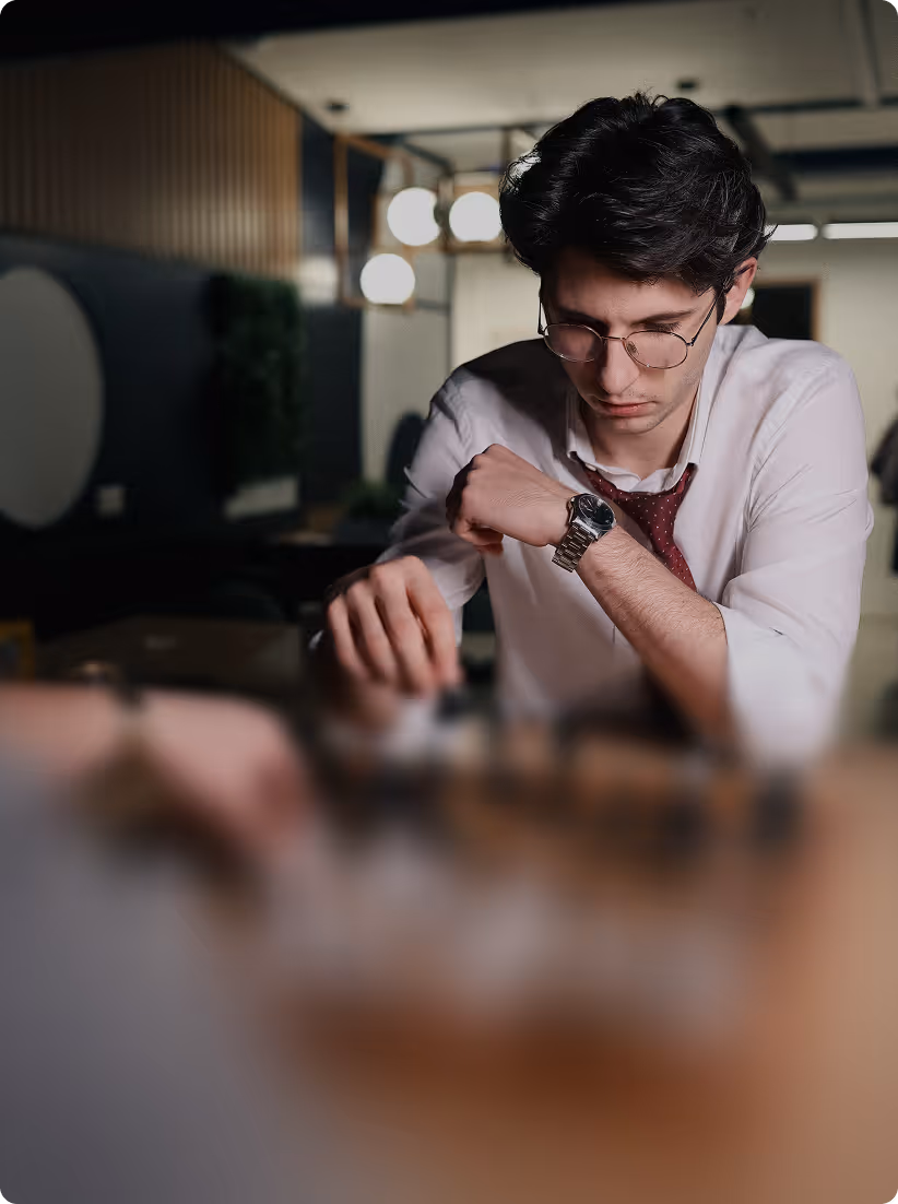 Mist-covered hills under a purple and pink sunset sky.