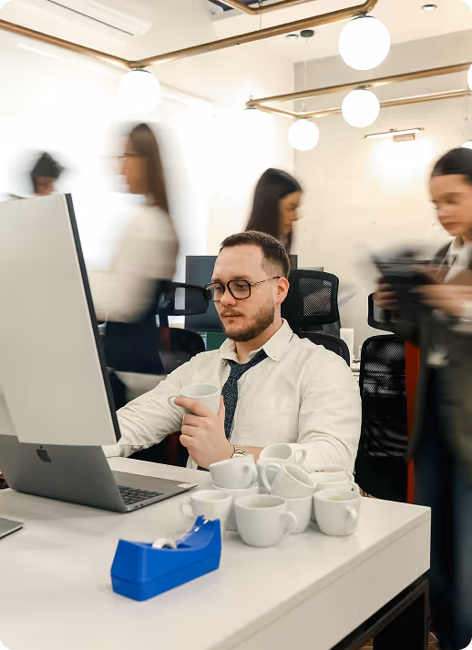 Mist-covered hills under a purple and pink sunset sky.