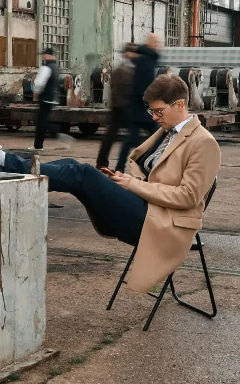 Mist-covered hills under a purple and pink sunset sky.