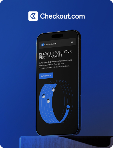 Flow Ninja Foresight audit showcase — Checkout.com website displayed on a mobile phone, featuring the "Ready to push your performance?" hero section.