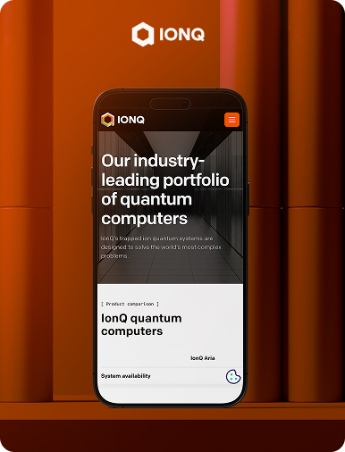Flow Ninja Foresight audit showcase — IonQ website displayed on a mobile phone, featuring the "Our industry-leading portfolio of quantum computers" homepage.