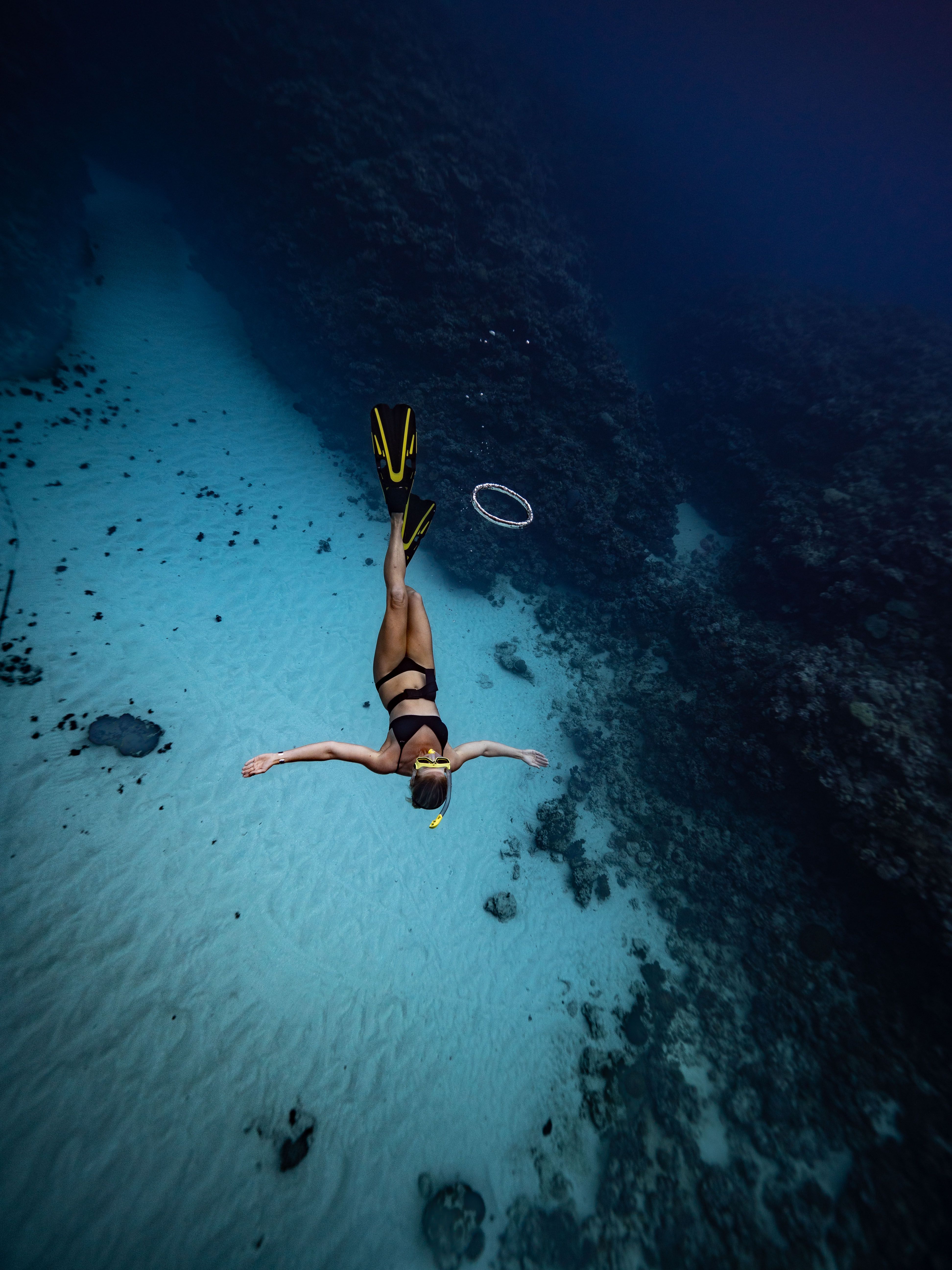 Traveler snorkeling in crystal‑clear St. John waters near Trunk Bay beach US Virgin Islands.