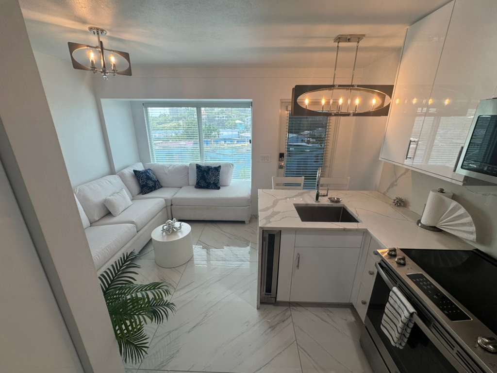 Contemporary white kitchen with marble counters in DGMI Properties suite St. John USVI.