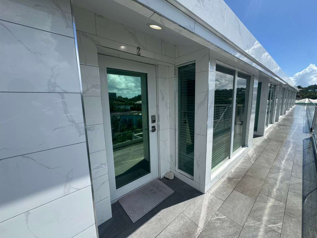 Apartment balcony entrance with glass doors at DGMI Properties Cruz Bay St. John.