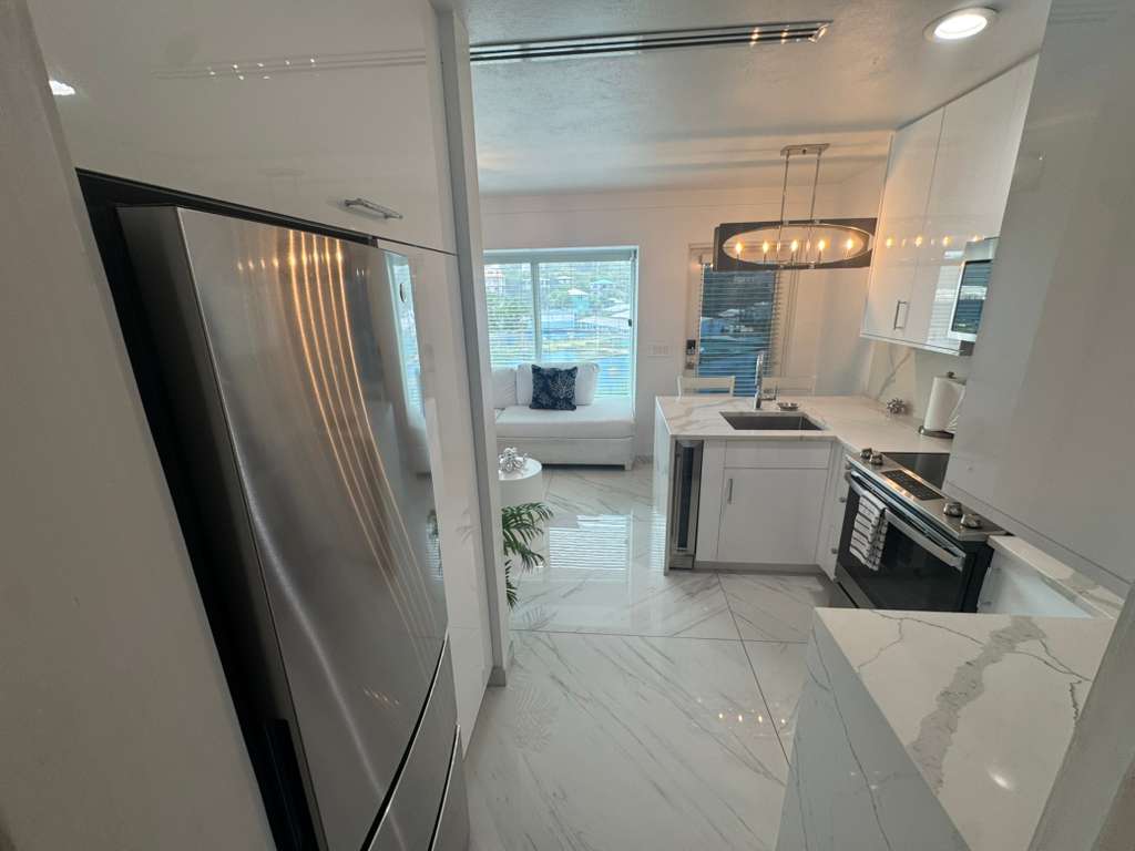 Contemporary open‑plan living and kitchen space in Dolphin Suites Unit 8 Cruz Bay St. John US Virgin Islands.