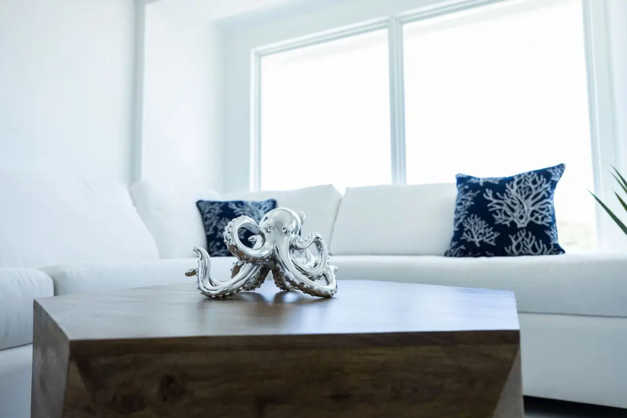 Bright living room with white sectional sofa in Dolphin Suites Unit 5 at DGMI Properties Cruz Bay St. John.
