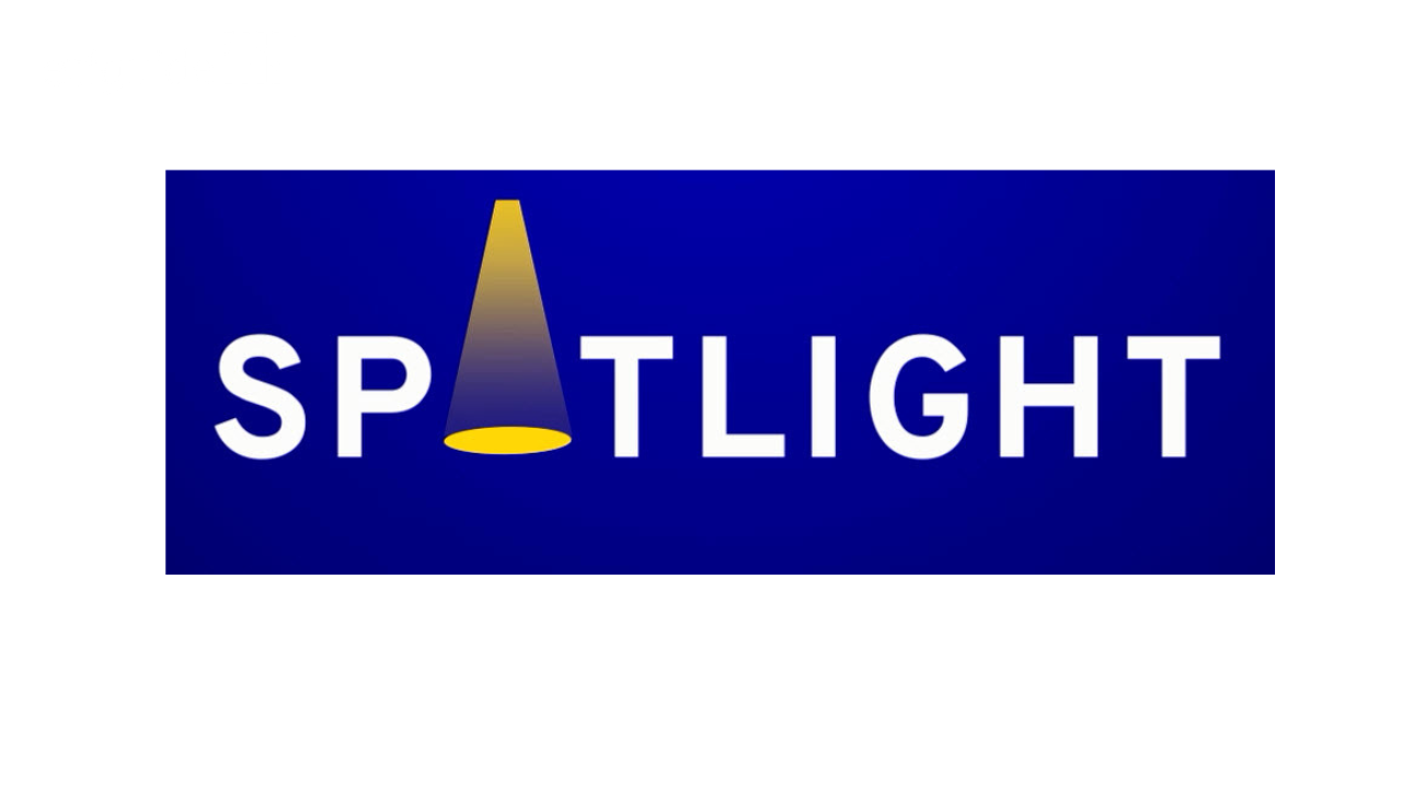 Word 'SPOTLIGHT' with the letter 'O' replaced by a yellow spotlight cone on a blue background.