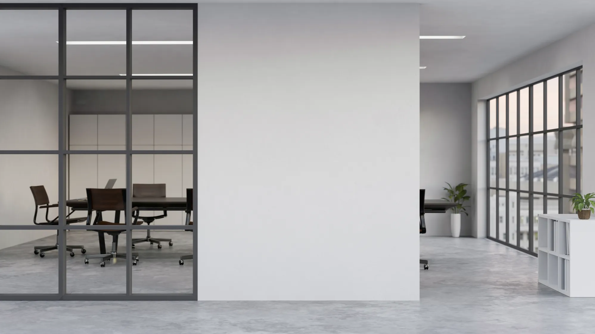 A modern open-plan office space with glass-walled conference room, empty desks, large windows, and minimalist decor.