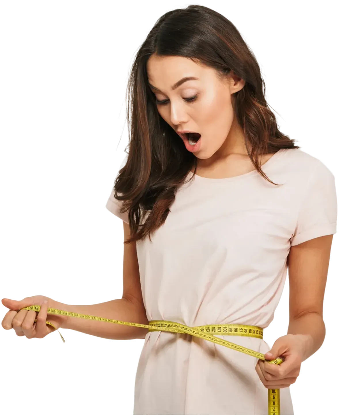 A surprised woman in a light pink shirt measures her waist with a yellow measuring tape.