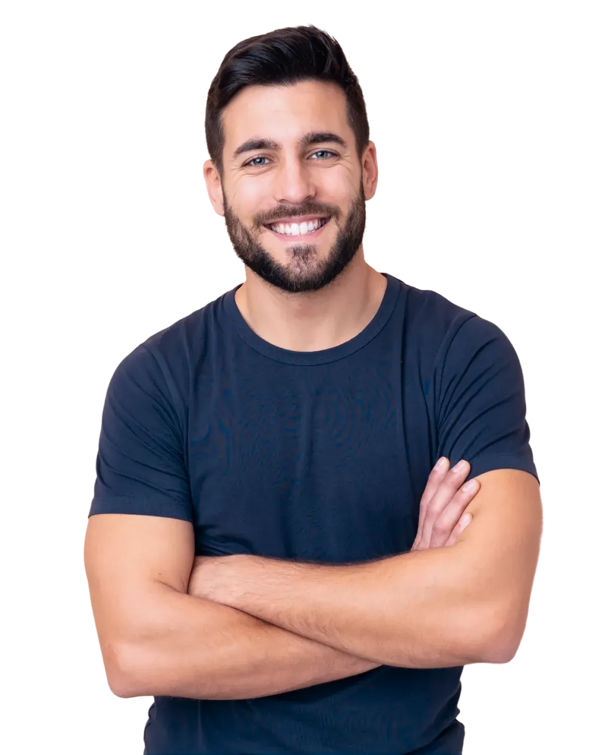 A young man with a beard and short dark hair, wearing a plain dark blue t-shirt, smiling with his arms crossed.