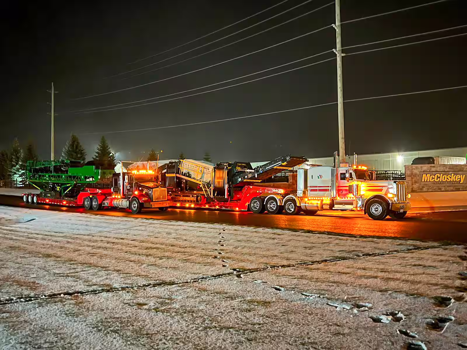 Donegal Services performing nighttime heavy haul transport of construction equipment in Chicagoland.
