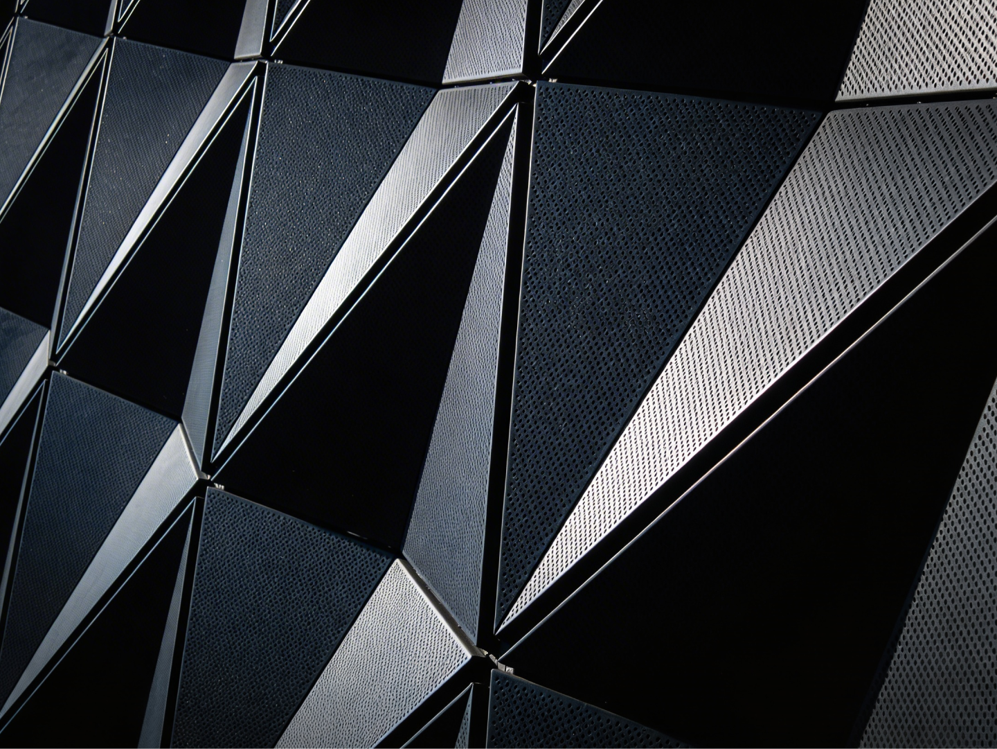 Perforated black metal panel