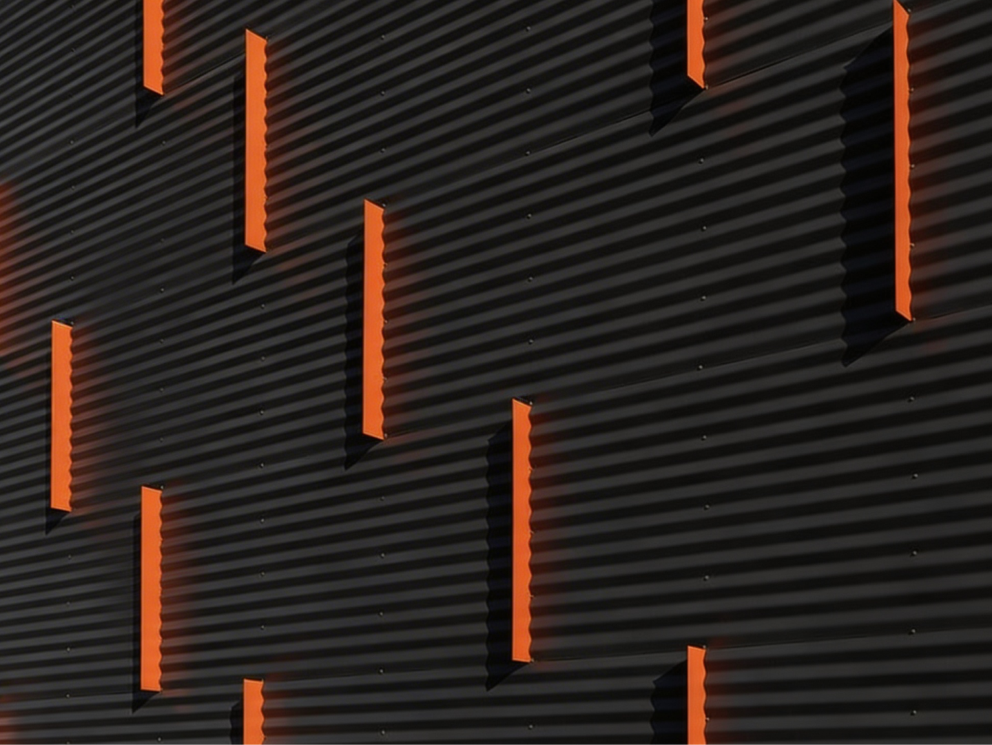 Black corrugated panel with orange accents
