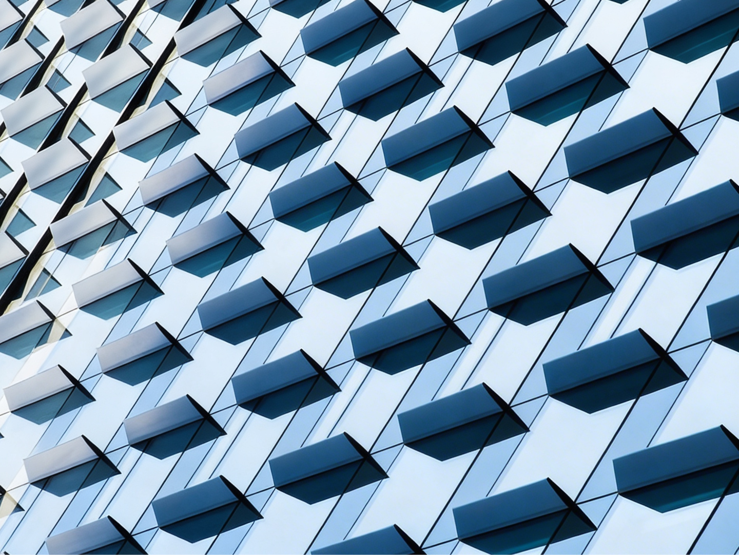 Glass building with metallic panneling