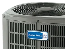 American Standard Silver Series outdoor air conditioning unit with fan on top.