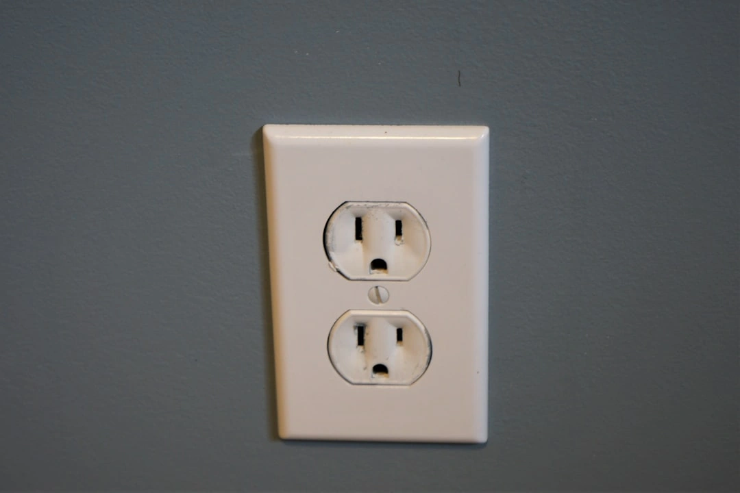 scorched electrical outlet plate showing signs of heat damage and arcing scorched electrical outlet plate showing signs of heat damage and arcing
