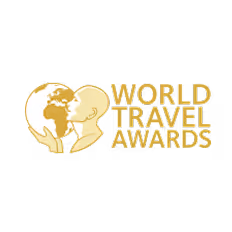 Logo showing a gold globe with continents and the text 'WORLD TRAVEL AWARDS' in gold capital letters.