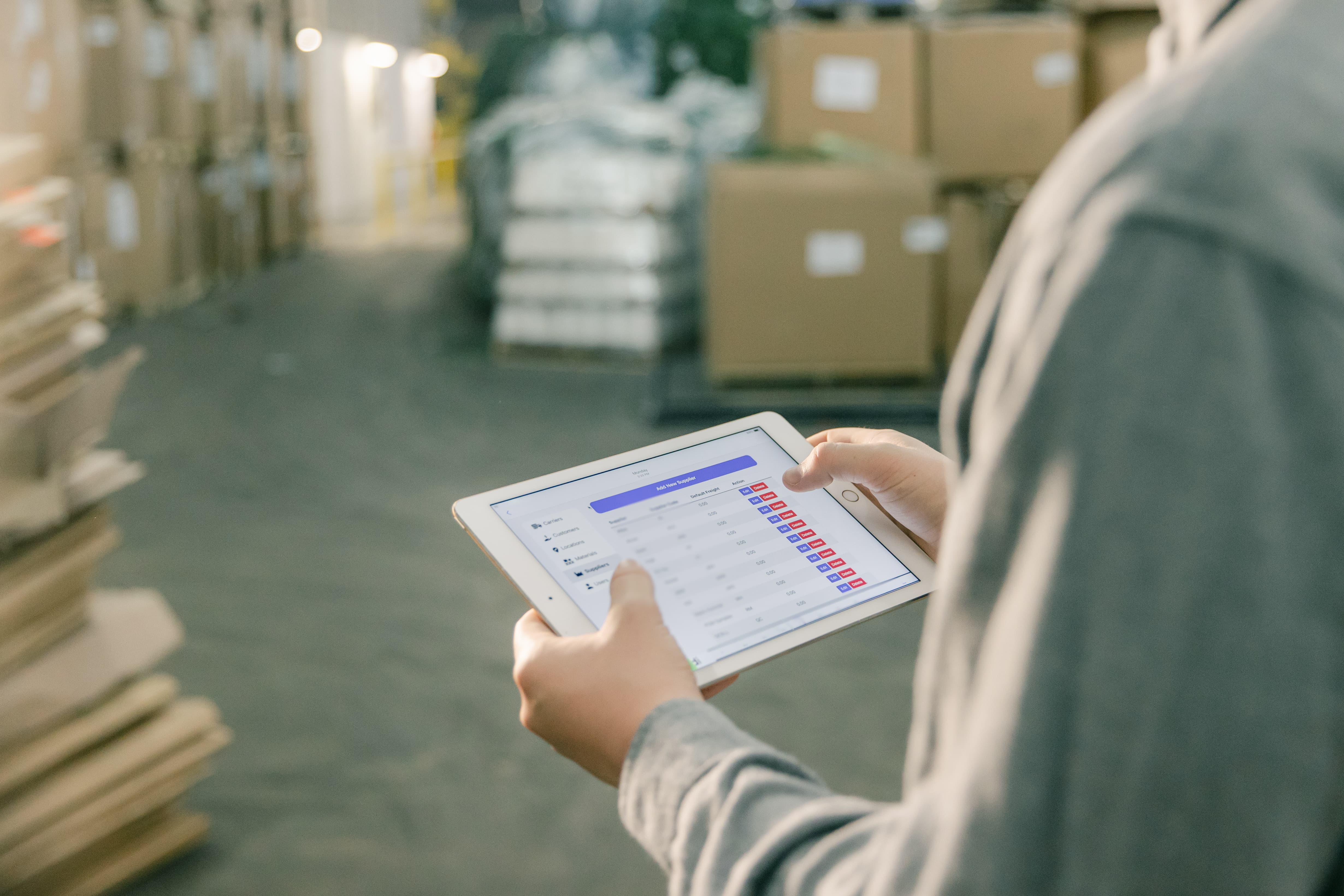 A warehouse operator using a WMS system to track shipments.