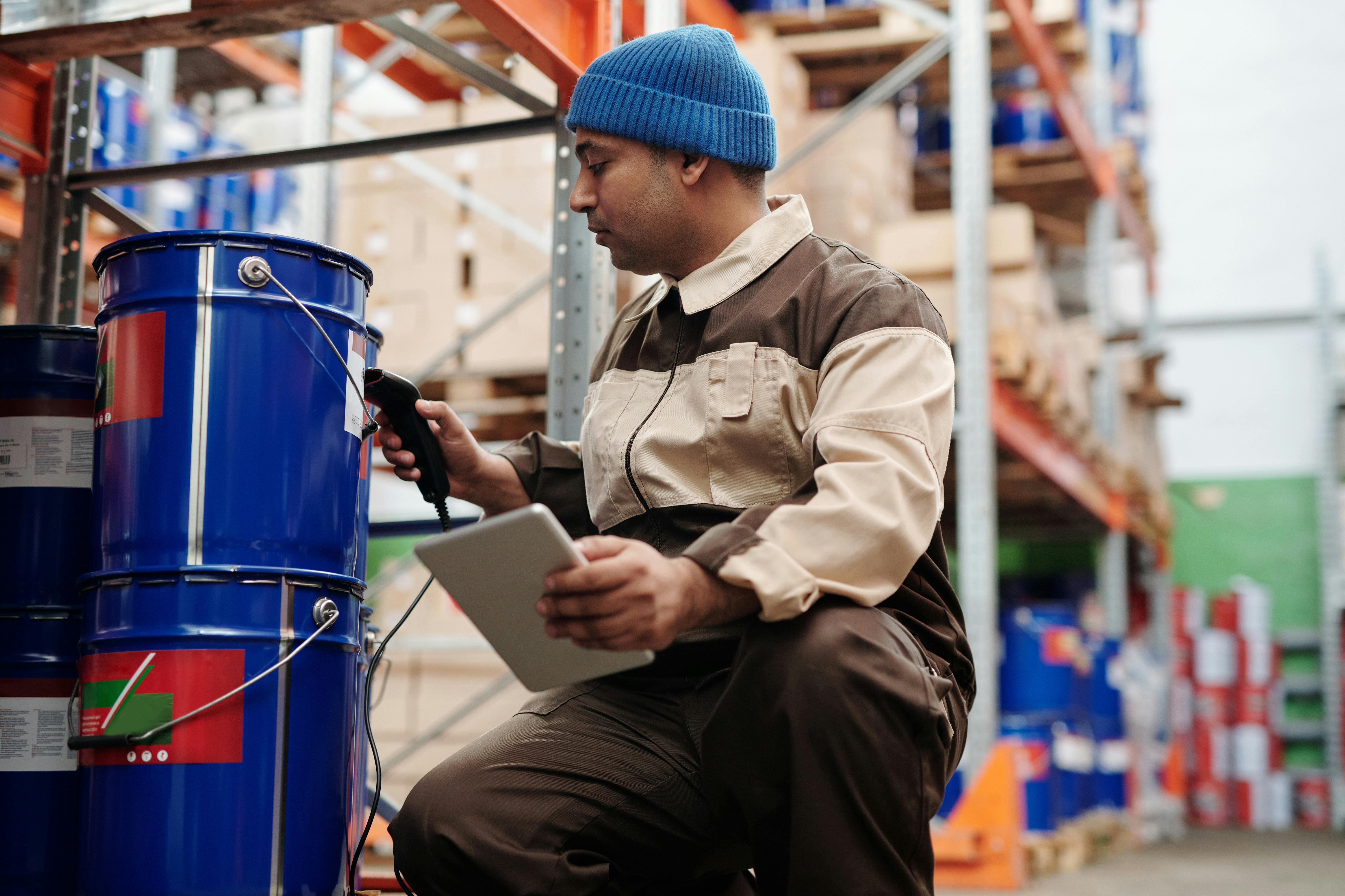 Warehouse employee scanning items with a barcode scanner