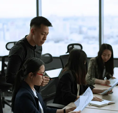 Business professionals in a meeting discussing new private equity fund.