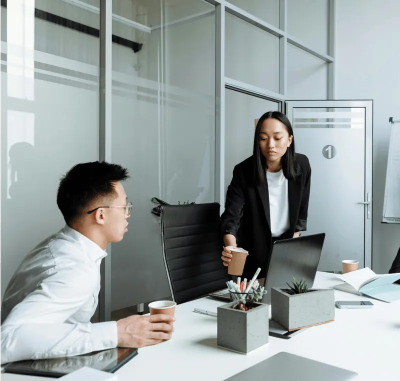 Business professionals in a meeting discussing new private equity fund.