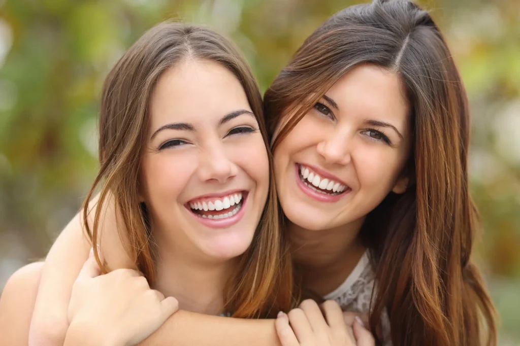 women smiling after getting teeth whitening Davie FL
