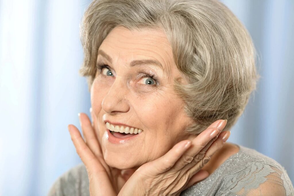 woman smiling after getting dental implants davie fl