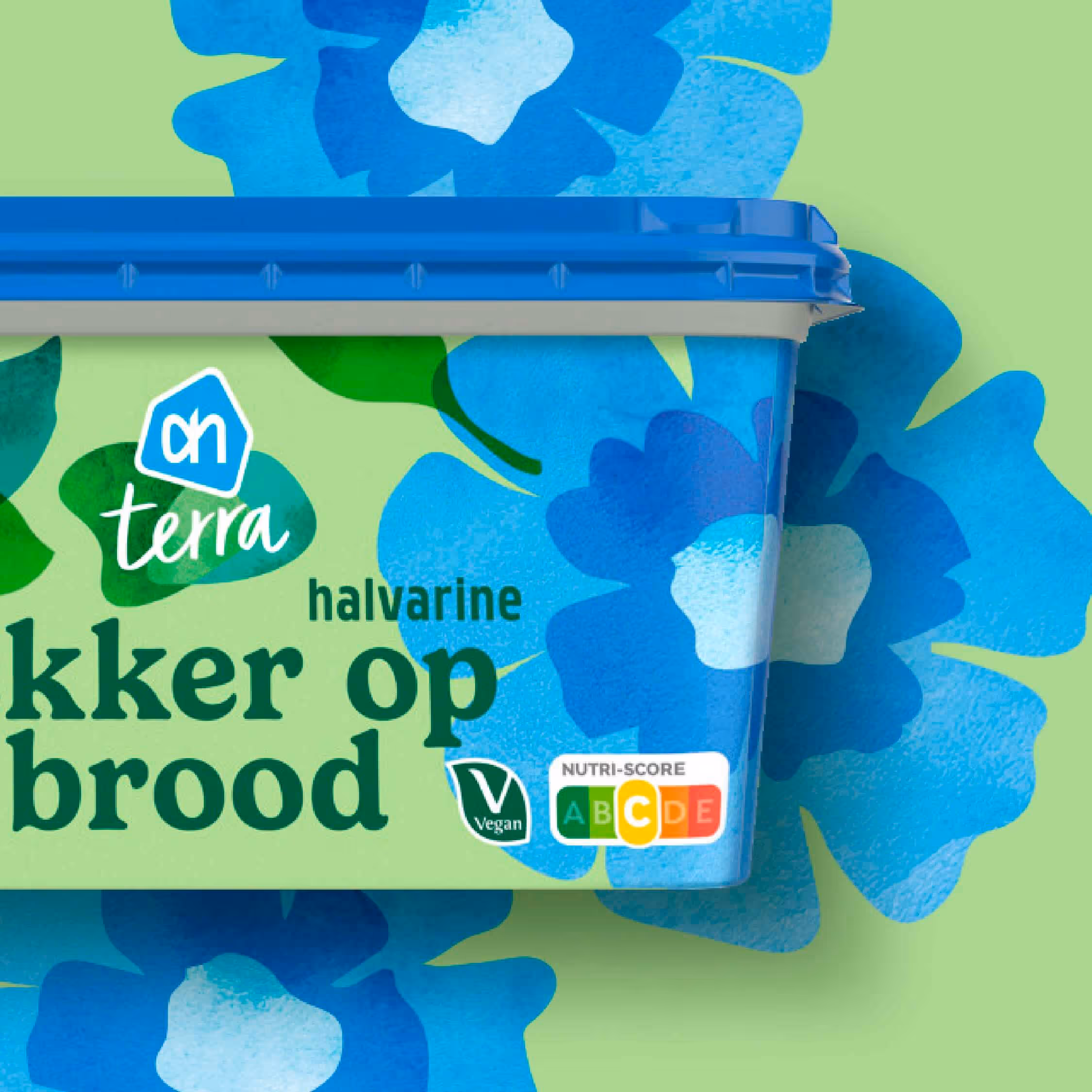 AH Terra halvarine tub with blue flower illustrations, vegan label, and Nutri-Score C rating.