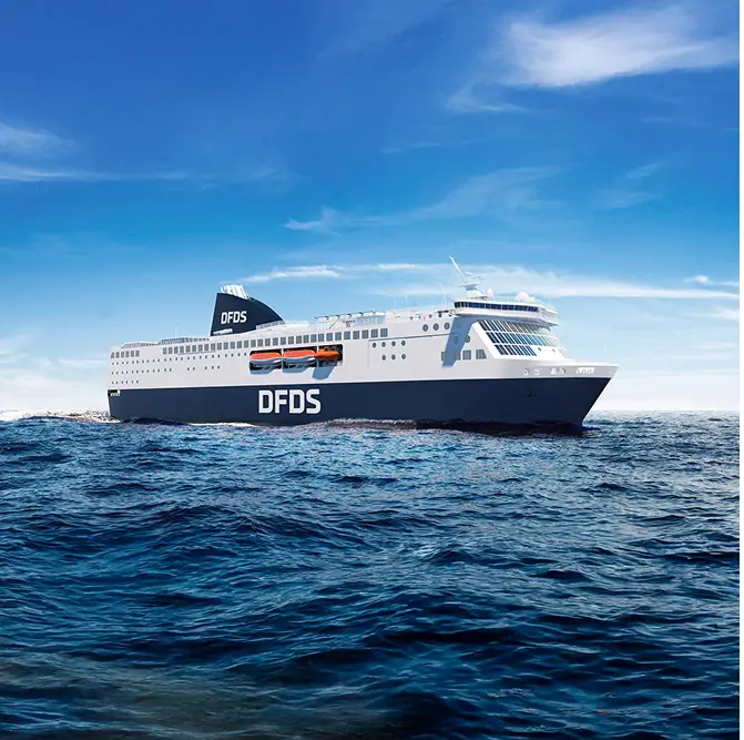 Large DFDS ferry sailing on calm sea under blue sky with some clouds.