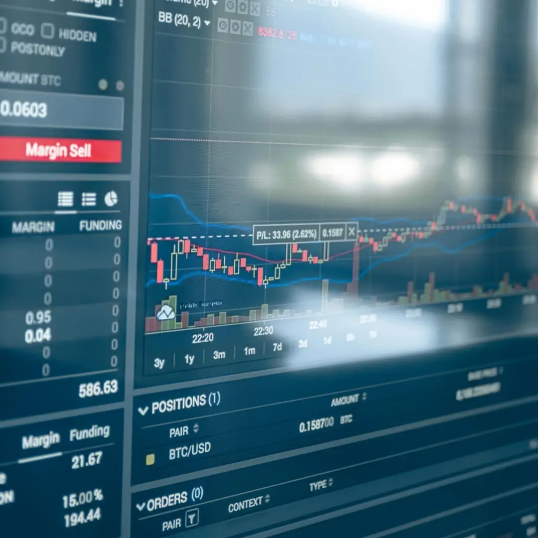 Digital trading screen showing candlestick chart, margin sell button, and BTC/USD trading positions.
