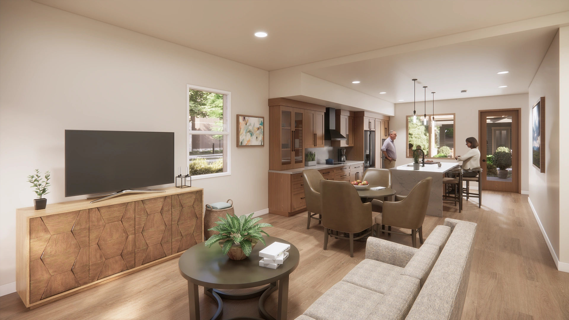 Modern open-concept living room and kitchen with beige sofa, round coffee table with plant, wooden dining table with chairs, and two people at kitchen island.