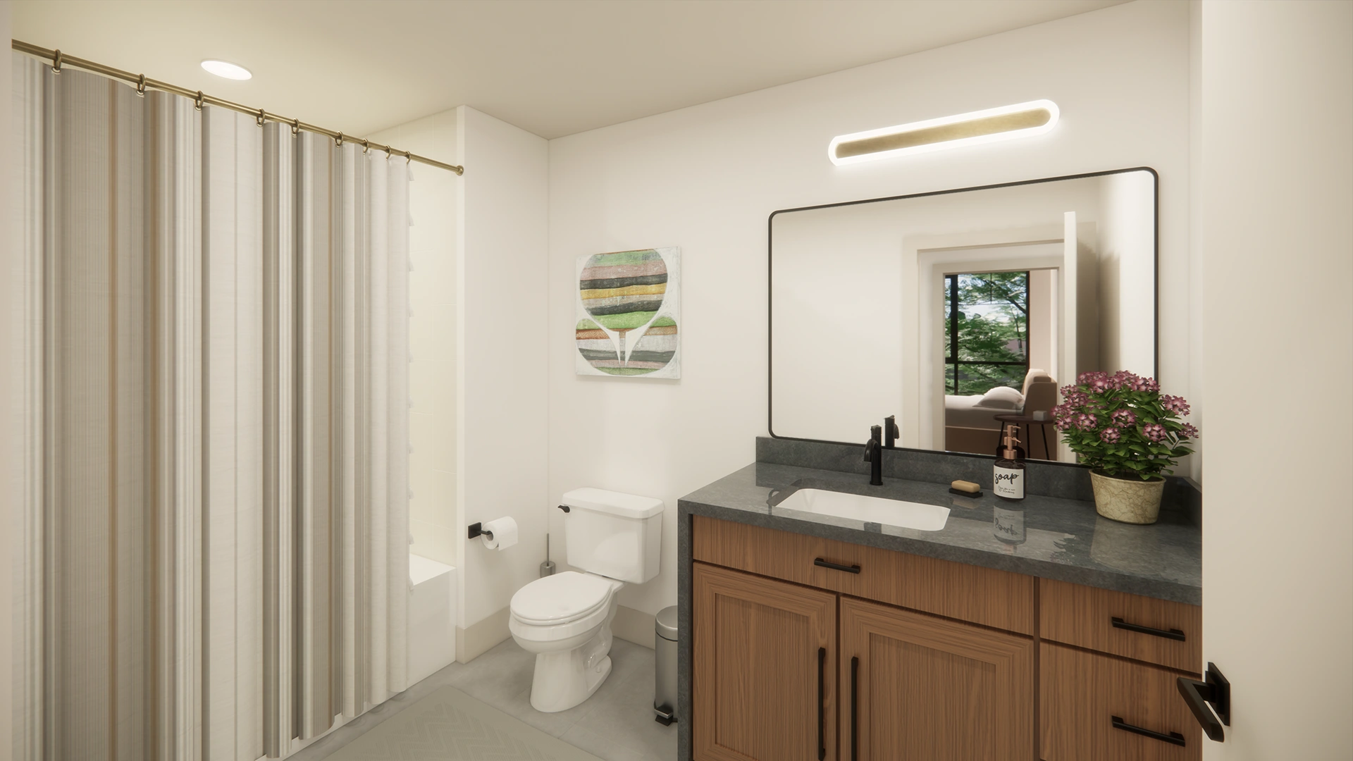 Modern bathroom with wooden vanity, gray countertop, rectangular mirror, toilet, striped shower curtain, and potted pink flowers.