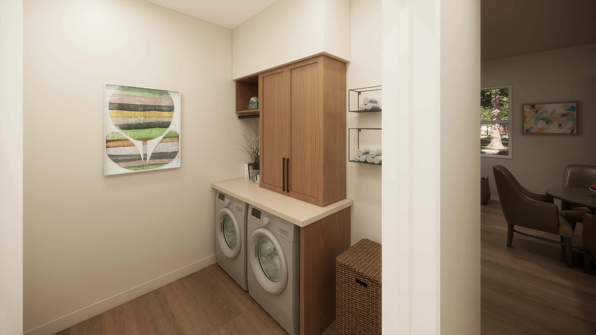 Modern laundry room with front-loading washer and dryer under a gray countertop and wooden cabinet, with wall-mounted shelves holding rolled towels.