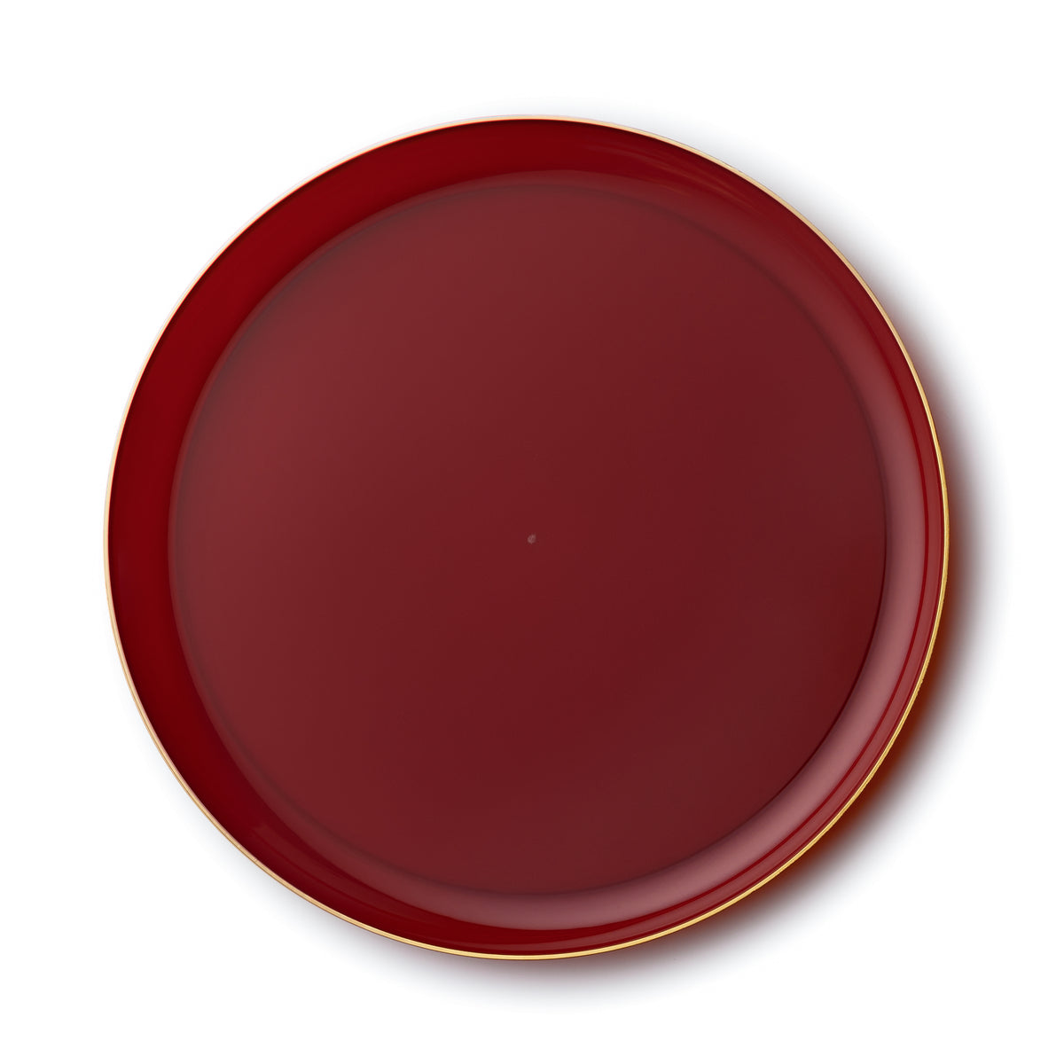 Round cranberry-red plate with a slim gold rim