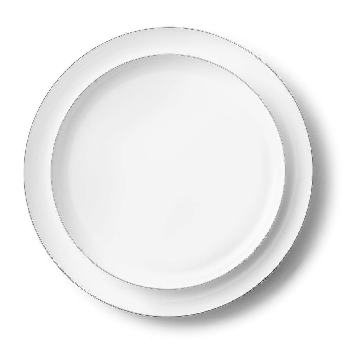 Layered white dinner and salad plates with slim silver rims