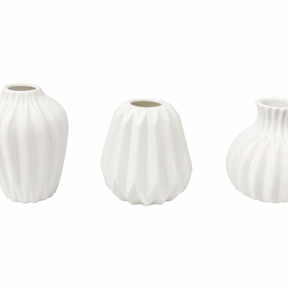 Set of three small white porcelain vases with ribbed and fluted surfaces
