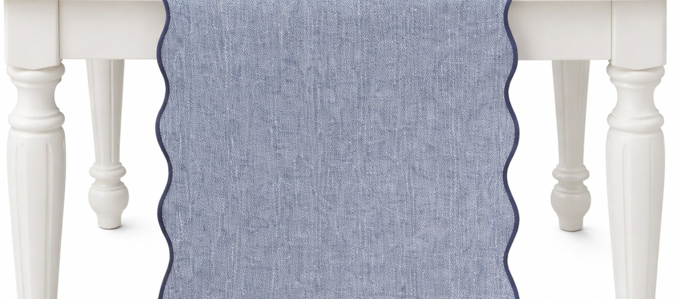 Blue and lemon Sukkot table with a blue scalloped runner